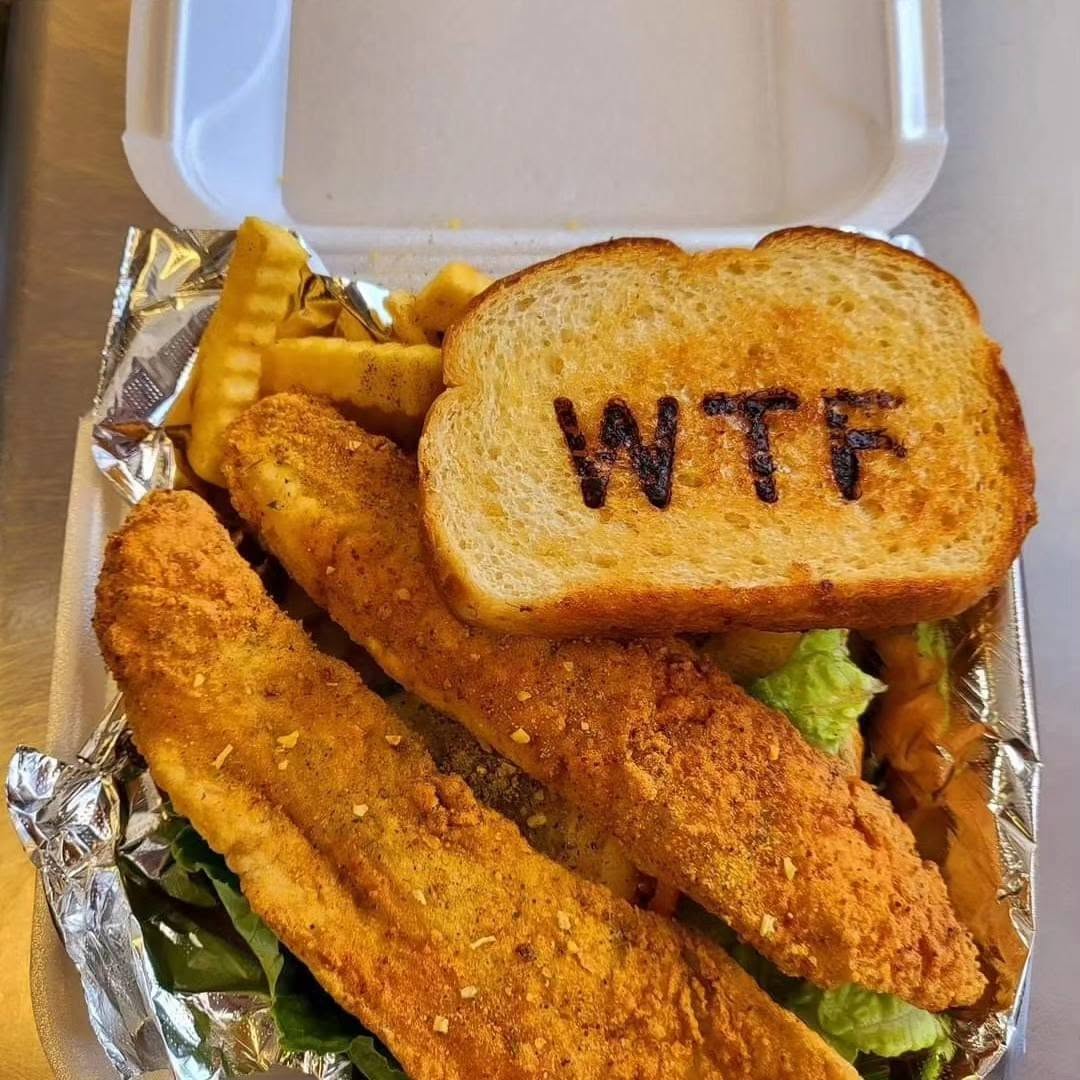 Fried fish plate with WTF branded Texas toast and crinkle fries